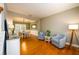 Inviting living room with hardwood floors and views into the adjacent dining area at 4015 Embassy Way, Lilburn, GA 30047