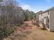 Spacious backyard featuring a deck, mature trees, and plenty of room for outdoor activities, nestled in a quiet neighborhood at 2160 Liberty Hts, Fairburn, GA 30213