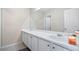 Bright bathroom featuring a white double sink vanity and large mirror at 2160 Liberty Hts, Fairburn, GA 30213