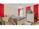 Bedroom with neutral walls accented by a red vertical stripe at 2160 Liberty Hts, Fairburn, GA 30213