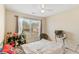 Bedroom features a window with curtains and ceiling fan light fixture at 2160 Liberty Hts, Fairburn, GA 30213