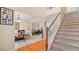 Inviting home foyer with hardwood floors, staircase, and views into adjacent dining and living rooms at 2160 Liberty Hts, Fairburn, GA 30213