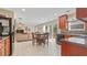 A kitchen and living space combination with stainless appliances, stone backsplash, and a sliding glass door to the deck at 2160 Liberty Hts, Fairburn, GA 30213