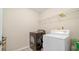 Featuring a laundry room with machines, it provides a functional space at 2160 Liberty Hts, Fairburn, GA 30213