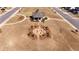 A beautiful aerial view of a home with a well-maintained lawn, walking paths, and a fire pit feature at 3489 Central Park Dr, Loganville, GA 30052