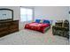 A spacious bedroom with a bed, dresser, and large window at 3489 Central Park Dr, Loganville, GA 30052