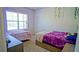 A bedroom with two twin beds, soft carpet, and a dresser at 3489 Central Park Dr, Loganville, GA 30052