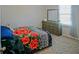 A simply styled bedroom with a bed, dresser, and soft carpet at 3489 Central Park Dr, Loganville, GA 30052