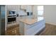 Modern kitchen with stainless steel appliances, a center island, and stylish countertops at 3489 Central Park Dr, Loganville, GA 30052