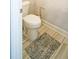 Clean half-bathroom featuring a standard toilet and neutral decor at 3489 Central Park Dr, Loganville, GA 30052