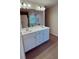 Bathroom with a double sink vanity, white cabinets, and modern fixtures at 4276 Notting Hill Dr # 23, Atlanta, GA 30331