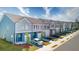 Street view of a row of new construction townhomes with car and landscaping at 4276 Notting Hill Dr # 23, Atlanta, GA 30331