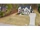 Aerial shot of a property showcasing the expansive driveway and manicured lawn at 4980 Wildeoak Trl, Douglasville, GA 30135