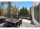 The large back deck is furnished with outdoor seating and a dining table for relaxation and entertaining at 4980 Wildeoak Trl, Douglasville, GA 30135