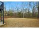 Spacious backyard surrounded by tall trees, offering privacy and a natural setting at 4980 Wildeoak Trl, Douglasville, GA 30135