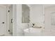 Bright bathroom features a walk-in shower and modern soaking tub with marble tile surround at 4980 Wildeoak Trl, Douglasville, GA 30135