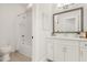 The well-lit bathroom features a vanity with lots of counter space and a shower-tub combination with white tile at 4980 Wildeoak Trl, Douglasville, GA 30135