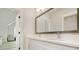 Bathroom featuring double sinks with white cabinetry, large mirrors, and modern fixtures at 4980 Wildeoak Trl, Douglasville, GA 30135