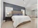 Spacious bedroom with a modern accent wall and an open floor plan at 4980 Wildeoak Trl, Douglasville, GA 30135