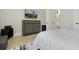 Bright bedroom with a wooden dresser, wall-mounted TV, and light wood floors at 4980 Wildeoak Trl, Douglasville, GA 30135