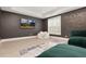 Bonus room with decorative wall accents, movie screen, and plush green seating at 4980 Wildeoak Trl, Douglasville, GA 30135