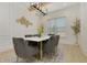 Elegant dining room featuring modern decor, hardwood flooring, decorative lighting, and panel molding at 4980 Wildeoak Trl, Douglasville, GA 30135