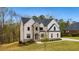 Stunning two-story home featuring light brick, stone accents, and a well-maintained front yard at 4980 Wildeoak Trl, Douglasville, GA 30135