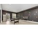 Spacious game room features a pool table and custom wall décor, perfect for entertainment and Gathering fun at 4980 Wildeoak Trl, Douglasville, GA 30135