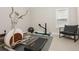 Bright gym space with home workout equipment and light colored walls at 4980 Wildeoak Trl, Douglasville, GA 30135
