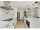 Bright kitchen with stainless steel appliances, white cabinets and a waterfall island at 4980 Wildeoak Trl, Douglasville, GA 30135