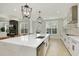 Open-concept kitchen with a waterfall island offers plenty of counter space and seating at 4980 Wildeoak Trl, Douglasville, GA 30135