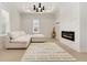 Cozy living room with a modern fireplace, an acoustic guitar, and recessed lighting at 4980 Wildeoak Trl, Douglasville, GA 30135