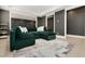 Cozy living room with modern decor, recessed lighting, and plush green sectional sofa at 4980 Wildeoak Trl, Douglasville, GA 30135
