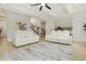 Spacious living room with white sofas and coffered ceilings offers plenty of seating at 4980 Wildeoak Trl, Douglasville, GA 30135