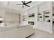 Inviting living room with built-in shelving, a modern fireplace, and a cozy white sofa at 4980 Wildeoak Trl, Douglasville, GA 30135