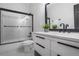 Clean bathroom with a shower-tub combination, black fixtures, and ample counter space at 652 Hugh Sw St, Atlanta, GA 30310