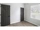 Cozy bedroom featuring modern floors, neutral walls, and a bright window at 652 Hugh Sw St, Atlanta, GA 30310