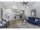Open-concept living room and kitchen filled with natural light and stylish furniture at 652 Hugh Sw St, Atlanta, GA 30310