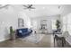 Cozy living room with hardwood floors, a ceiling fan and ample natural light at 652 Hugh Sw St, Atlanta, GA 30310