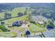 Expansive aerial view featuring a golf course, clubhouse, and tennis courts at 1 Biscayne Nw Dr # 410, Atlanta, GA 30309