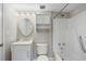 Clean bathroom featuring shower-tub combo with storage shelving and traditional faucet and hardware at 1 Biscayne Nw Dr # 410, Atlanta, GA 30309