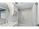 Clean bathroom featuring shower-tub combo with storage shelving and traditional faucet and hardware at 1 Biscayne Nw Dr # 410, Atlanta, GA 30309