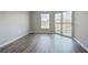 Bedroom with new floors and lots of light from outdoor patio access at 1 Biscayne Nw Dr # 410, Atlanta, GA 30309