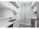 Bright kitchen featuring stainless steel appliances, quartz countertops and modern lighting fixture at 1 Biscayne Nw Dr # 410, Atlanta, GA 30309