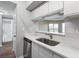 Bright kitchen featuring stainless steel appliances, quartz countertops, undermount sink and gooseneck faucet at 1 Biscayne Nw Dr # 410, Atlanta, GA 30309