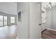 View of open living area, hardwood floors, and connecting kitchen at 1 Biscayne Nw Dr # 410, Atlanta, GA 30309