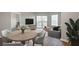 Living room with dining area, stylish furnishings, and balcony access at 1 Biscayne Nw Dr # 410, Atlanta, GA 30309