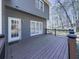 Spacious back deck overlooks a landscaped backyard with a door leading to the house at 423 Eagle Ridge Trl, Canton, GA 30114