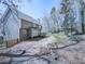 View of the back exterior of the home, featuring the deck and landscaping at 423 Eagle Ridge Trl, Canton, GA 30114