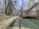 Stone pathway in backyard leading to deck; mature trees offer shade and privacy at 423 Eagle Ridge Trl, Canton, GA 30114